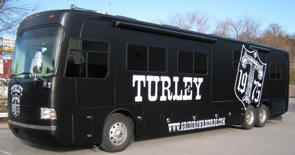 Matte black bus wrap with cut vinyl bus graphics