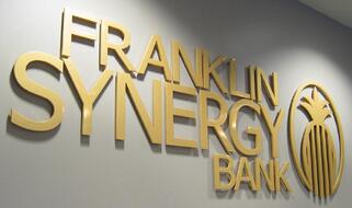 Gold dimensional logo letters sign