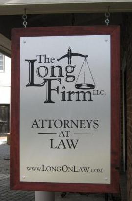 Hanging wood and brushed aluminum law firm sign