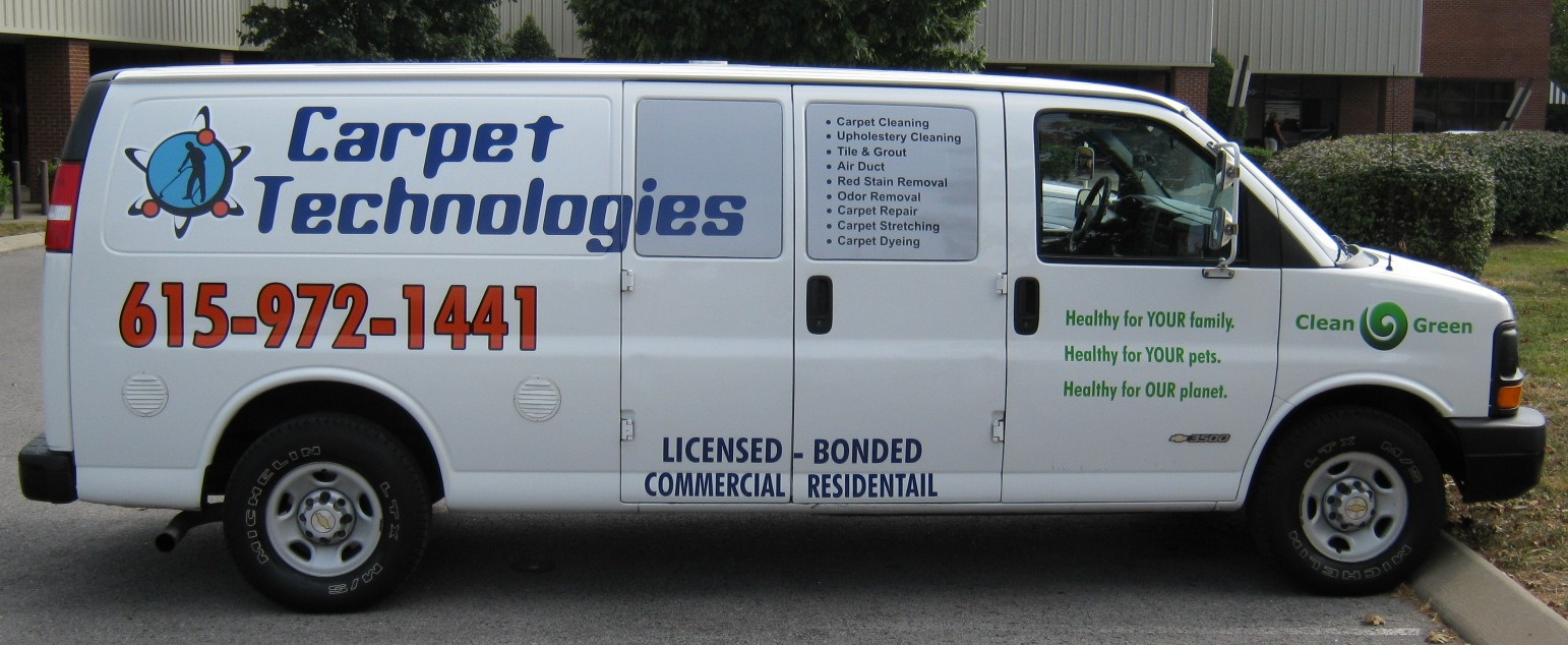 Cut vinyl lettering and digital logos on work van