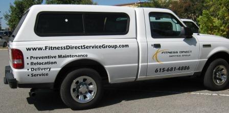 Service truck advertising with vinyl lettering and logo