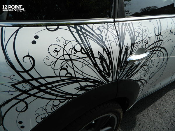 Close up view of detailed cut vinyl car graphics for Mini Cooper. 12-Point SignWorks