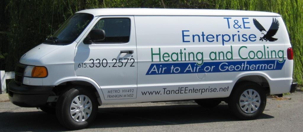 Cargo van branded with vinyl lettering and logo