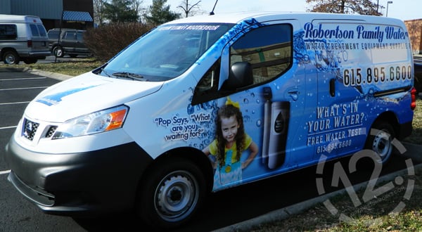 Driver's side view of the Robertson Family Water NV200 advertising wrap. 12-Point SignWorks