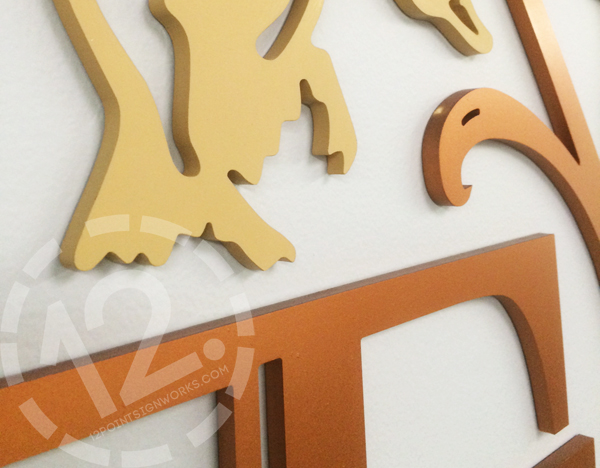 A close-up of the dimensional acrylic pieces and the custom colors for the TWF logo sign. 12-Point SignWorks