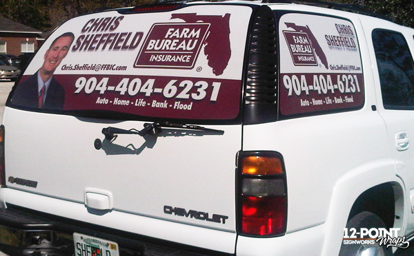 Perforated window vinyl used for mobile advertising on a Farm Bureau vehicle. 12-Point SignWorks