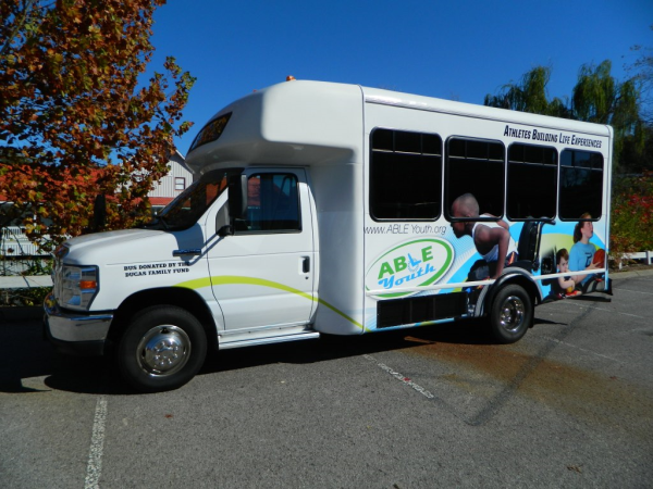 ABLE Youth bus wrap design and installation by 12-Point SignWorks