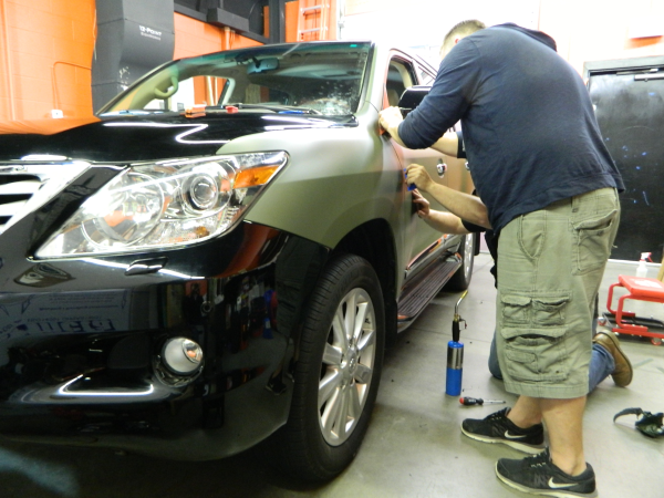 SUV matte wrap installation in progress