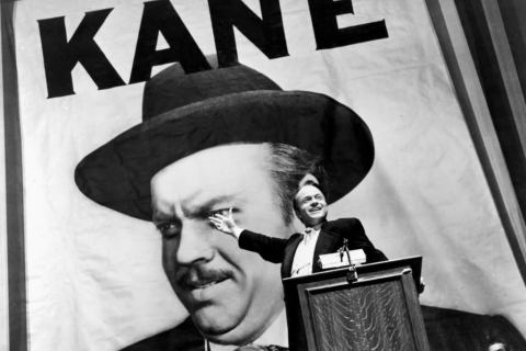 Citizen Kane in front of huge campaign banner