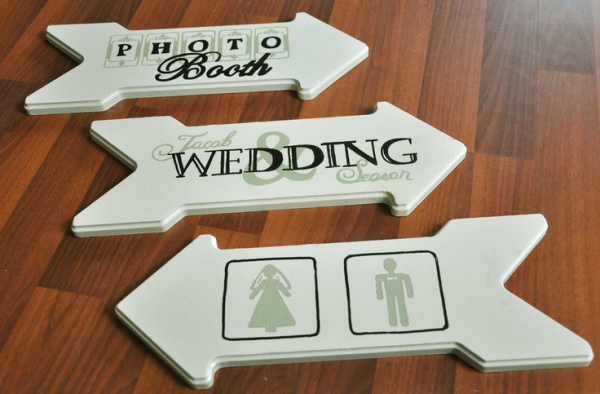 Wooden wayfinding signs for a wedding
