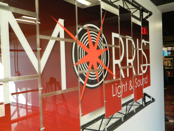 Sign made using architectural display cables and panels for Morris Light and Sound. 12-Point SignWorks.