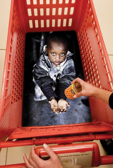 Feed South Africa marketing campaign using vinyl stickers in grocery store shopping carts.