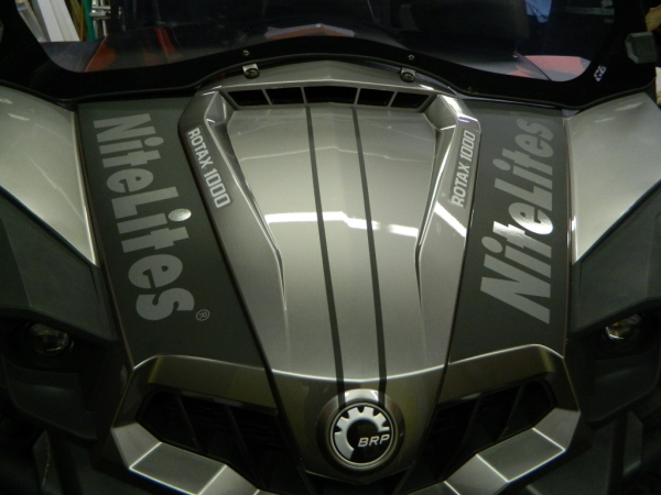 Detailed view of branding graphics for NiteLites by 12-Point SignWorks on Can-Am ATV