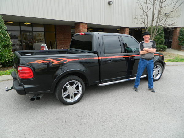 Charles and his new truck flames | 12-Point SignWorks