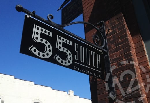 A custom hanging sign for 55 South on Main Street in downtown Franklin, TN. 12-Point SignWorks