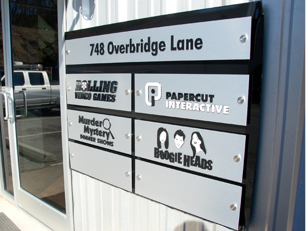 A custom exterior directory sign for Rolling Video Games and their tenants. 12-Point SignWorks
