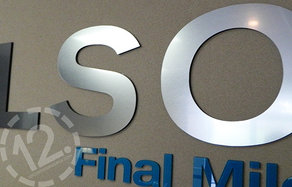Dimensional logo sign with a Rowmark simulated metal face for LSO Final Mile. 12-Point SignWorks