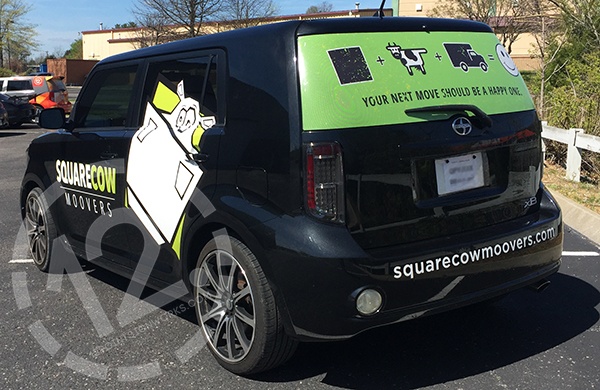 Square Cow Movers advertising graphics with perforated window vinyl for the new Nashville TN location. 12-Point SignWorks - Franklin TN