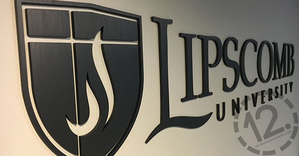 A close-up of the Lipscomb University logo sign, showing the brushed finish of the anodized aluminum material. 12-Point SignWorks - Franklin, TN