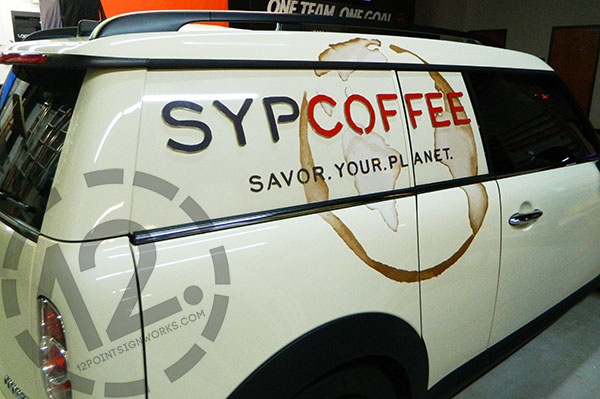 The installed advertising graphics on the SYPCOFFEE MINI Cooper. 12-Point SignWorks - Franklin TN