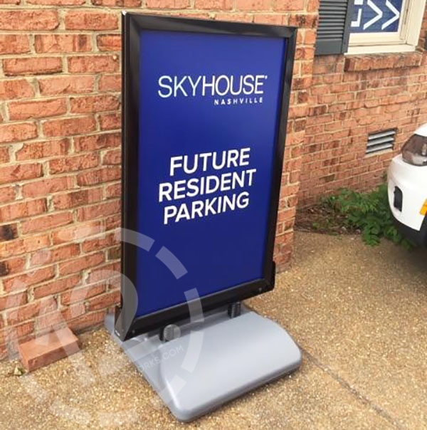 A custom sign with a weighted base for SkyHouse Nashville's pre-leasing office. 12-Point SignWorks - Franklin, TN