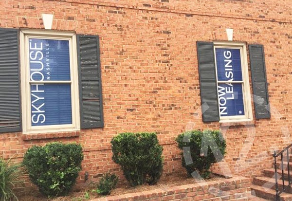 Two of the six exterior windows with perforated vinyl graphics for SkyHouse Nashville. 12-Point SignWorks - Franklin TN