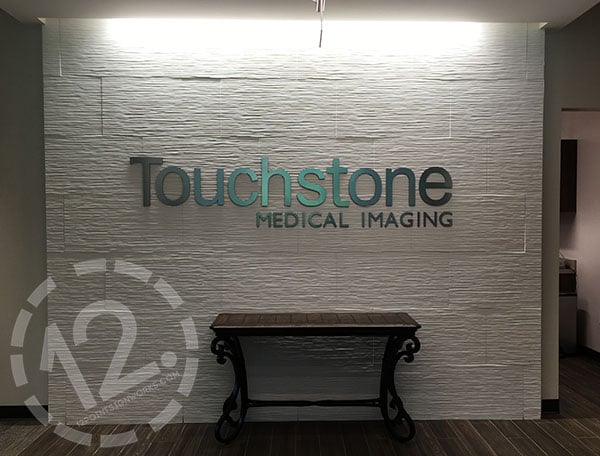 Installed dimensional lettering on a custom ceramic tile feature wall for Touchstone Medical Imaging. 12-Point SignWorks - Franklin TN