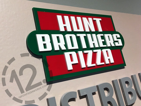 A close-up of the Hunt Brothers Pizza dimensional logo in their red, green and white brand colors. 12-Point SignWorks - Franklin TN