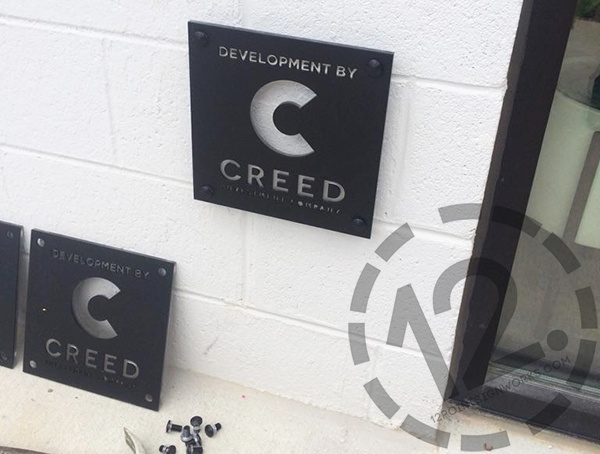 The Creed Investment Company exterior logo sign installed in the Gulch in Nashville. 12-Point SignWorks - Franklin TN