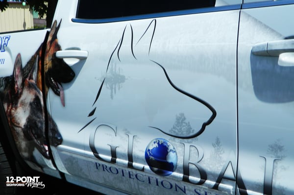 A close-up of the advertising wrap for Global K9 Protective Services. 12-Point SignWorks