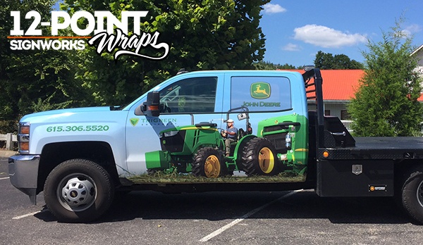 One side of the completed advertising wrap for TriGreen Equipment. 12-Point SignWorks - Franklin TN