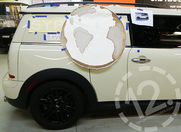 The MINI Cooper with the templates and decal on for placement. 12-Point SignWorks - Franklin TN