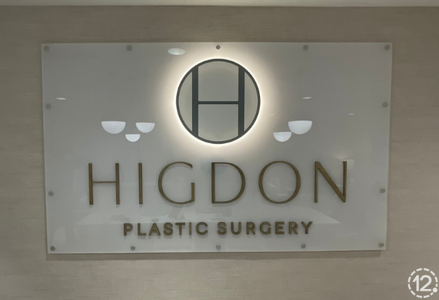 wall sign with custom branding graphics for higdon plastic surgery privacy glass vinyl custom vinyl graphics