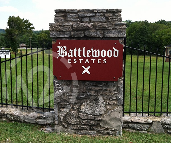 Custom logo sign for Battlewood Estates on stone column. 12-Point SignWorks