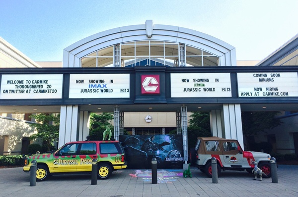Jurassic Park Explorer and Jeep parked outside of the movie theater. 12-Point SignWorks