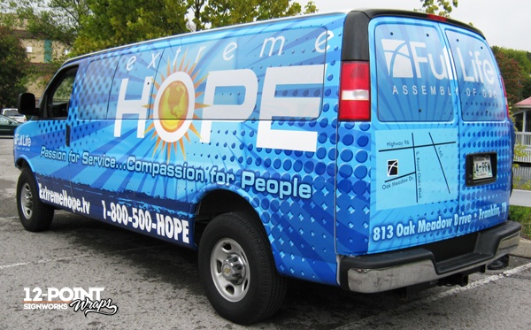Driver's side view of Extreme Hope/Full Life van by 12-Point SignWorks.