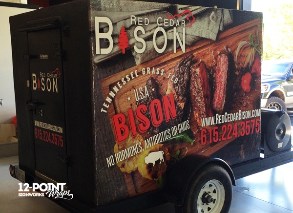 The completed custom wrap on Red Cedar Bison's freezer trailer. 12-Point SignWorks