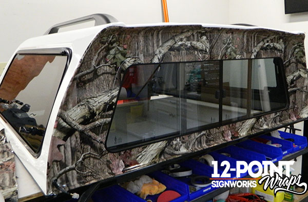 The wrap installation for the truck topper in our Franklin TN shop. 12-Point SignWorks 