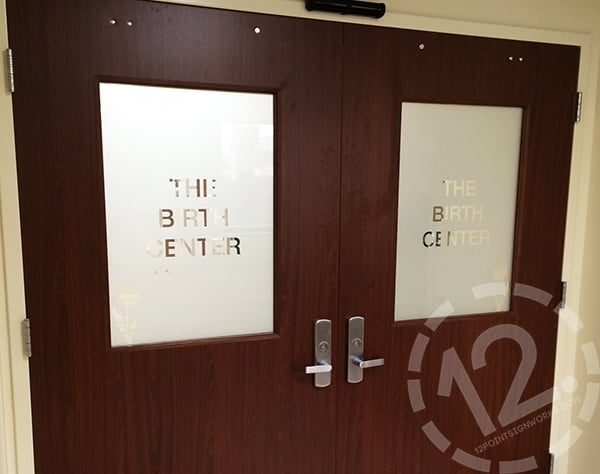 Etched glass vinyl covering The Birth Center door windows at TriStar Hendersonville Medical Center. 12-Point SignWorks