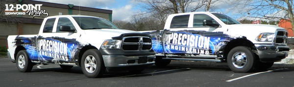 Both completed Dodge pick-up trucks in the 12-Point SignWorks parking lot in Franklin, TN.