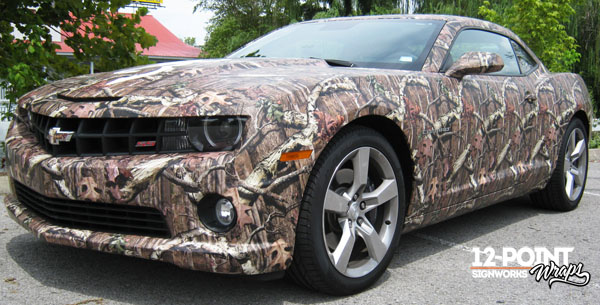 We installed the Mossy Oak pattern as a full coverage wrap on this Dodge Camaro. 12-Point SignWorks