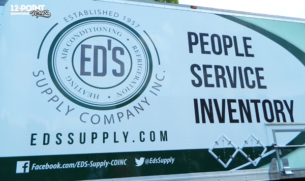 A close-up of the circular logo for Ed's Supply Company on the side of the advertising wrap by 12-Point SignWorks in Franklin, TN.