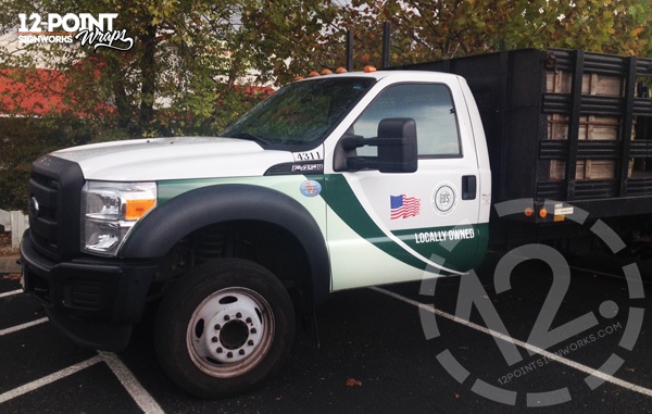 The Ed's Ford F-450 with the completed wrap on the cab. 12-Point SignWorks