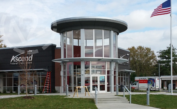 A view of the building's exterior with the airplane hanging in the rotunda. 12-Point SignWorks