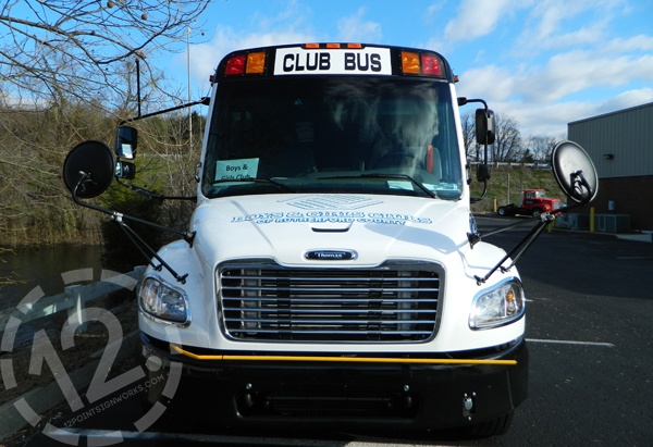 The completed front of the BGCRC bus, showing the white vinyl and the logo decal. 12-Point SignWorks