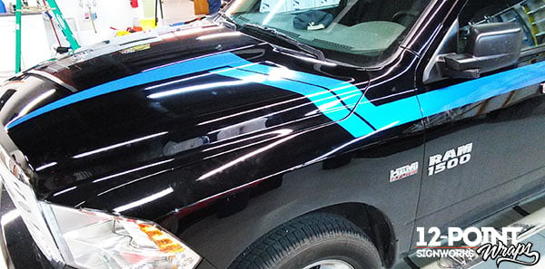 A view of the custom stripes on the hood of the 2015 Dodge Ram 1500. 12-Point SignWorks