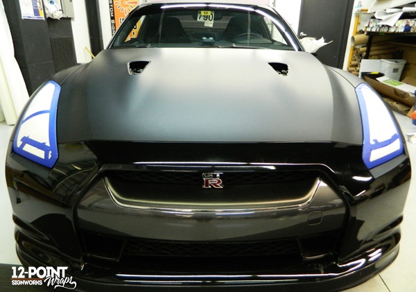 The front of the Nissan GT-R during installation. 12-Point SignWorks