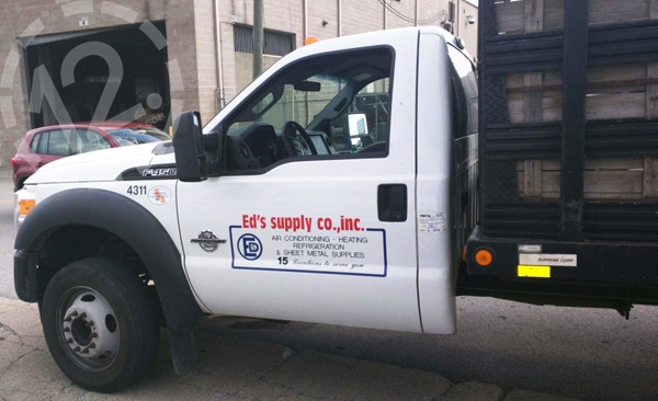 The Ford F-450  flatbed with the old Ed's decals. 12-Point SignWorks