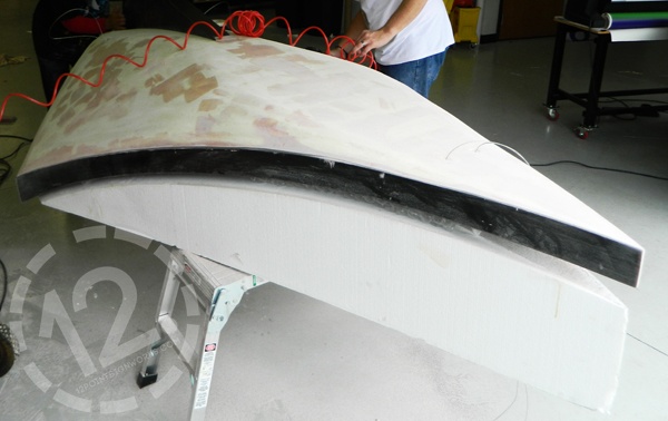The Ascend FCU airplane during fabrication with a urethane coat and the PVC around the edges. 12-Point SignWorks