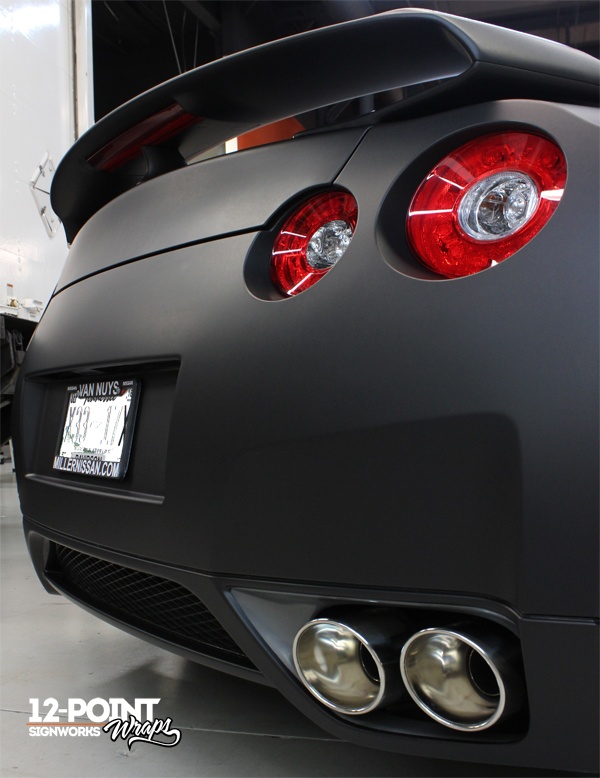 A close-up of the taillights and wing on the 2010 Nissan GT-R. 12-Point SignWorks